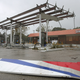 Metal lies on the ground at a gas station damaged by the heavy winds of Hurricane Matthew, October 7, 2016 on Port Orange, Florida. Hurricane Matthew passed by offshore as a catagory 3 hurricane bringing heavy winds and minor flooding. (Image: Getty)